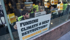 Activists protesting in Sydney in May against coal financing by the Commonwealth Bank. Photo: Kate Ausburn